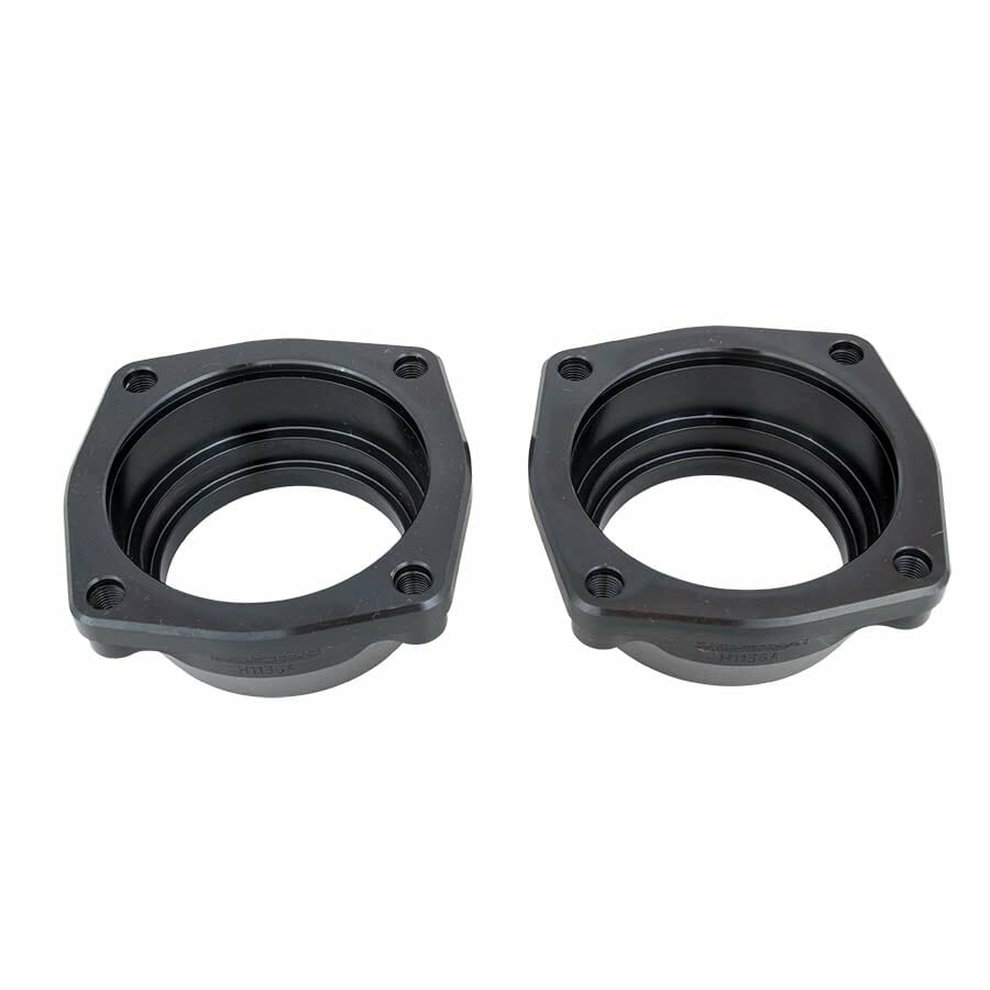 Two black metal flanges on a white background